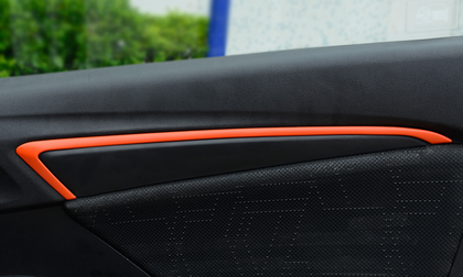 Color: Orange - Modified door trims in the car